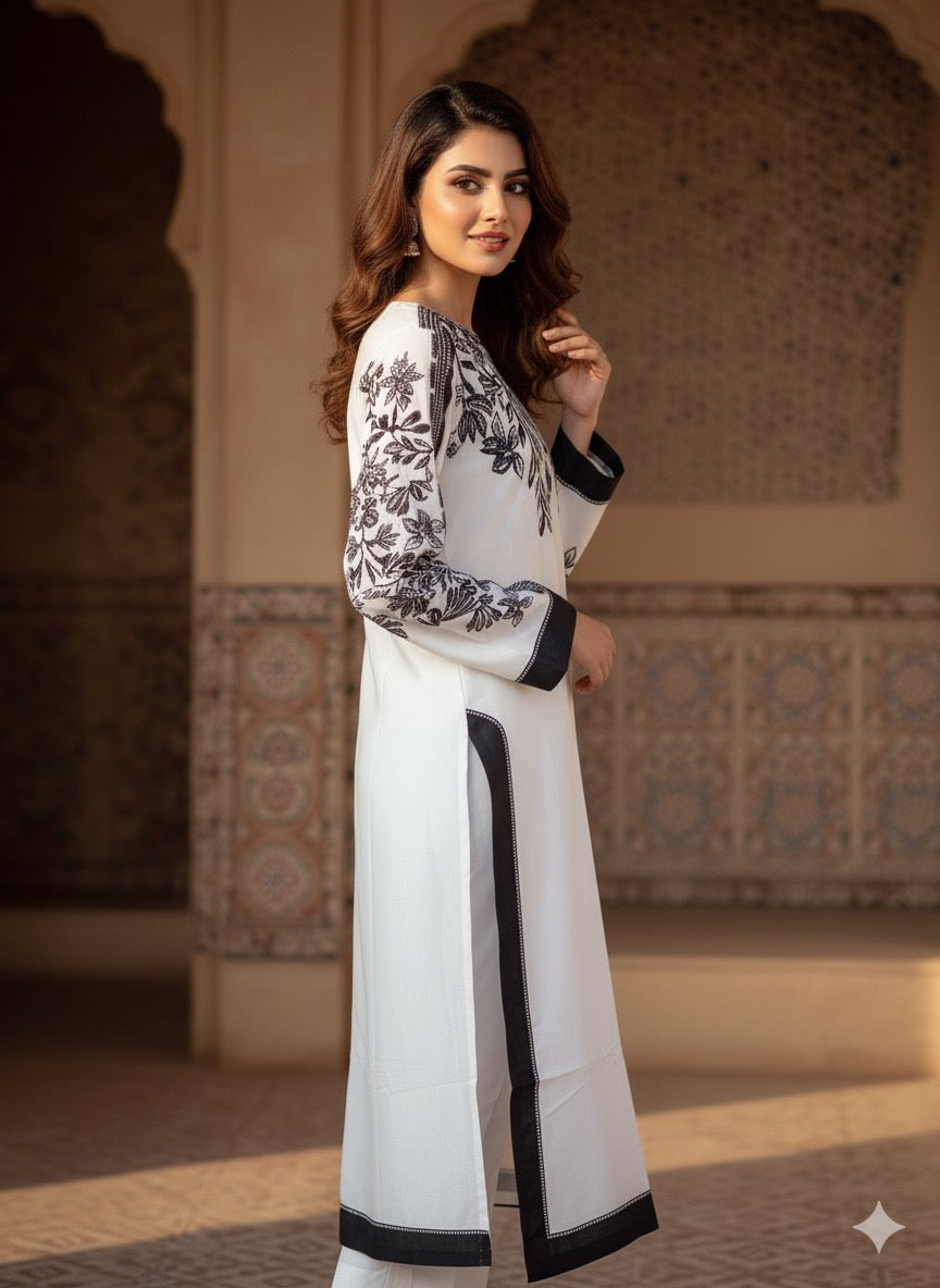 The ensemble is a chic, printed three-piece suit (fabric silk )