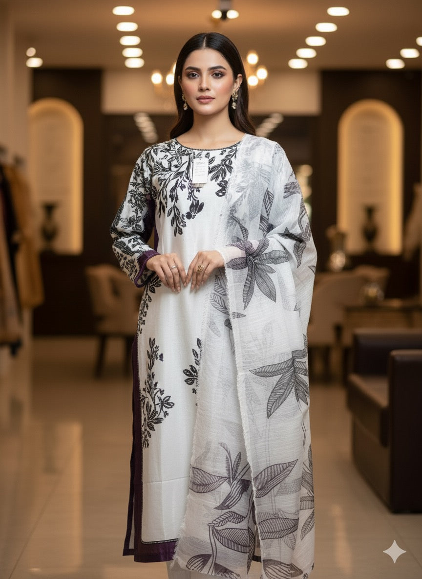 The ensemble is a chic, printed three-piece suit (fabric silk )